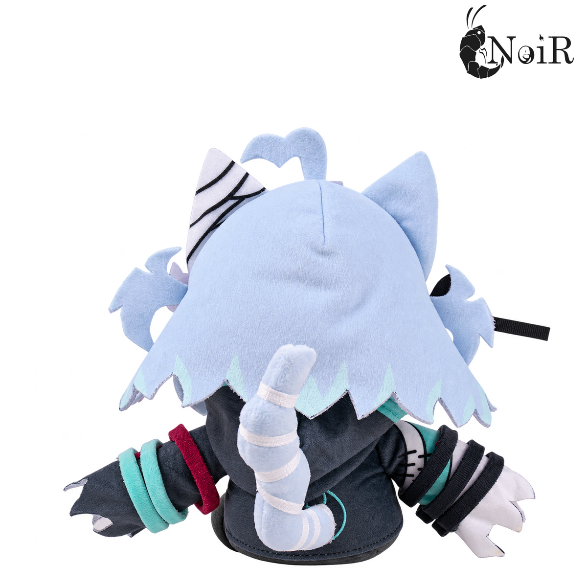 Back view of the Nani plushie with jagged light-blue hair and striped tail wrapped in white bandages