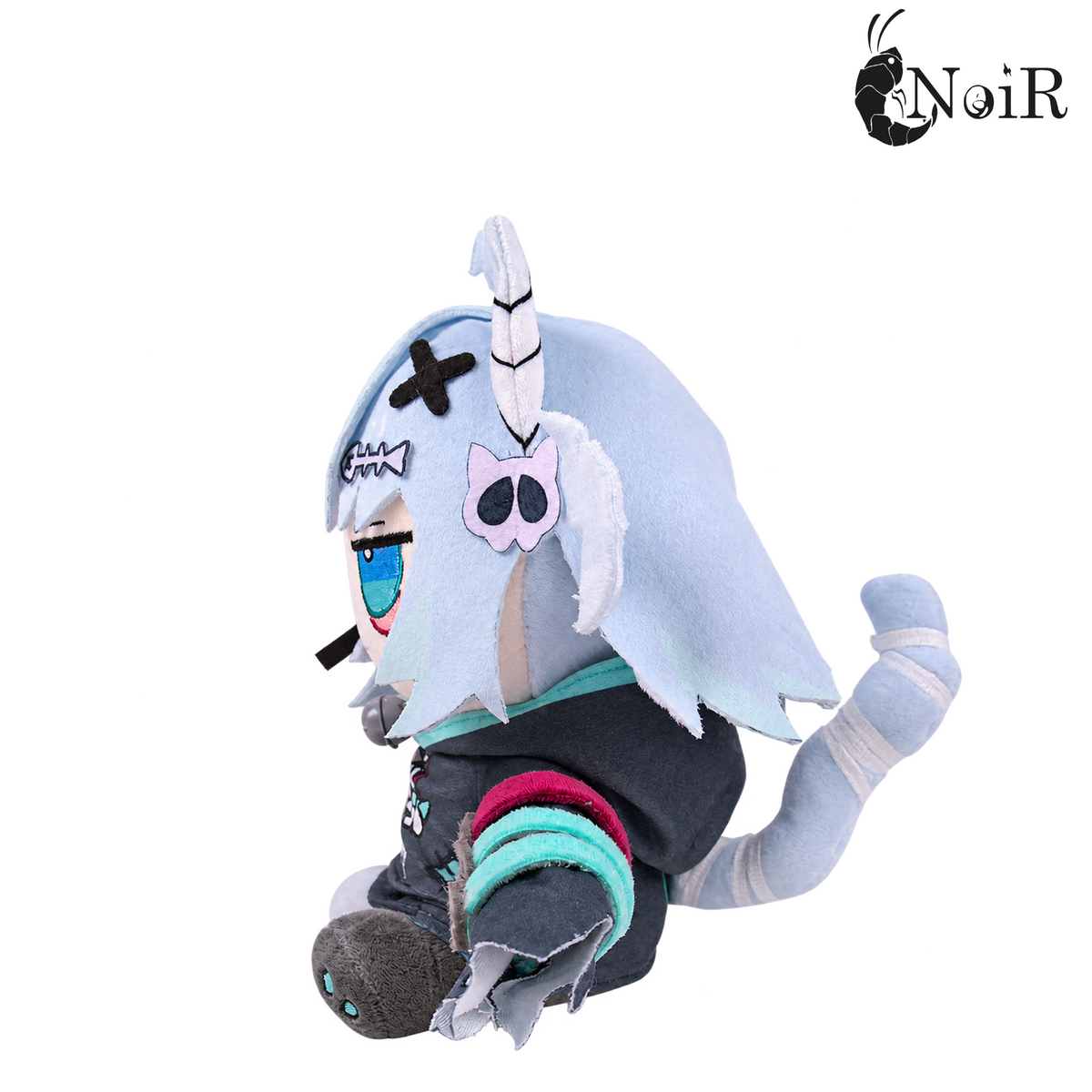 Nani plushie right side profile showing striped bandaged tail and hair clips